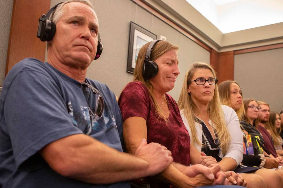 Parents Steve and Jamie Minkler are comforted by victim advocate Sara Owen while listening to t ...