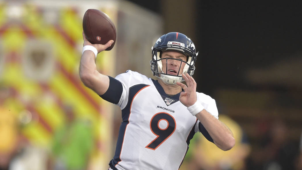 Denver Broncos quarterback Kevin Hogan throws a pass against the Atlanta Falcons during the fir ...
