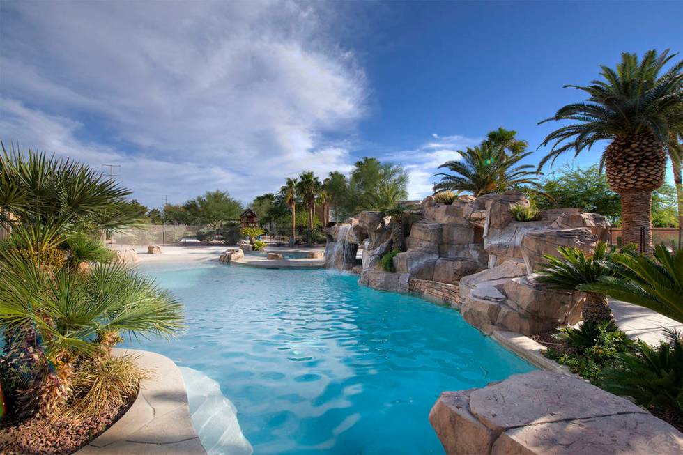 The pool has waterfalls. (Synergy|Sotheby’s International Realty)