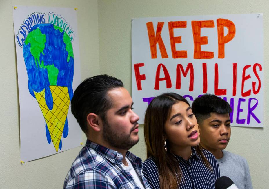 Omar Arellano Cruz, 21, left, Kimberly Arellano Cruz, 16, and AJ Arellano Cruz,12, respond to a ...