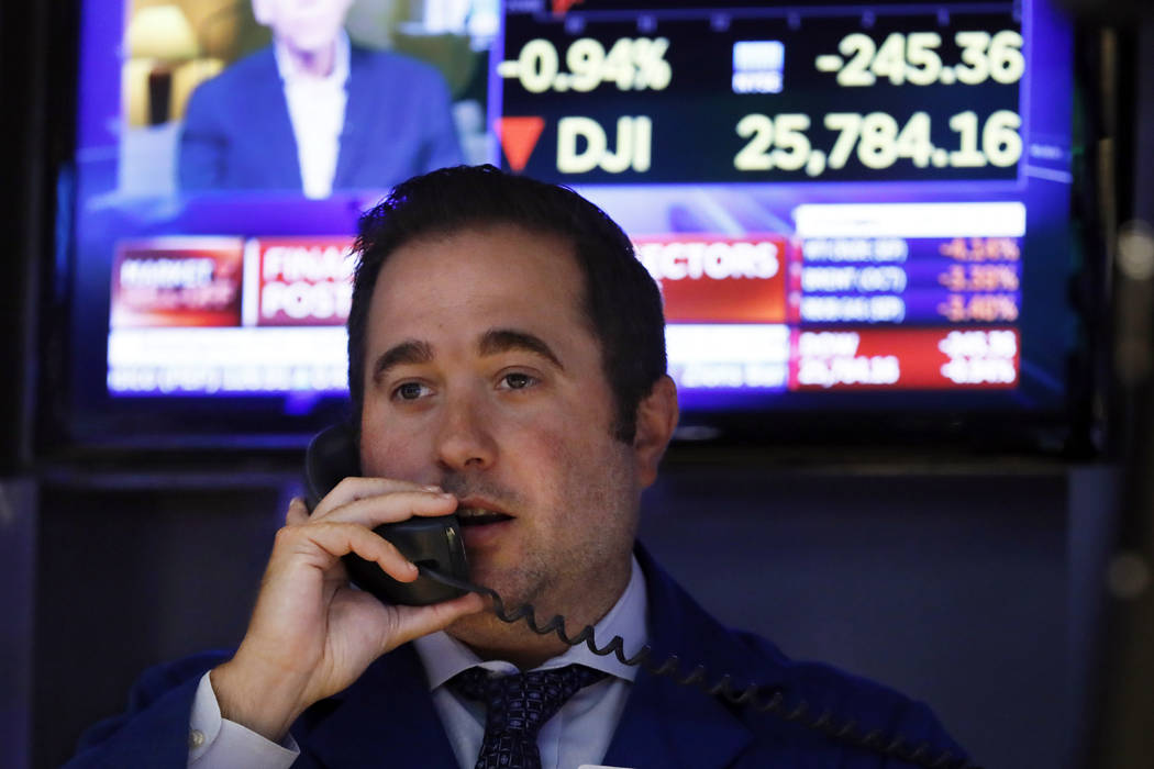 Specialist Gennaro Saporito works on the floor of the New York Stock Exchange, Wednesday, Aug. ...