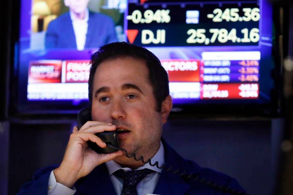 Specialist Gennaro Saporito works on the floor of the New York Stock Exchange, Wednesday, Aug. ...