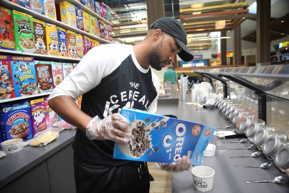 Chris Burns, owner The Cereal Killerz Kitchen, fills an order at his restaurant inside the Gall ...