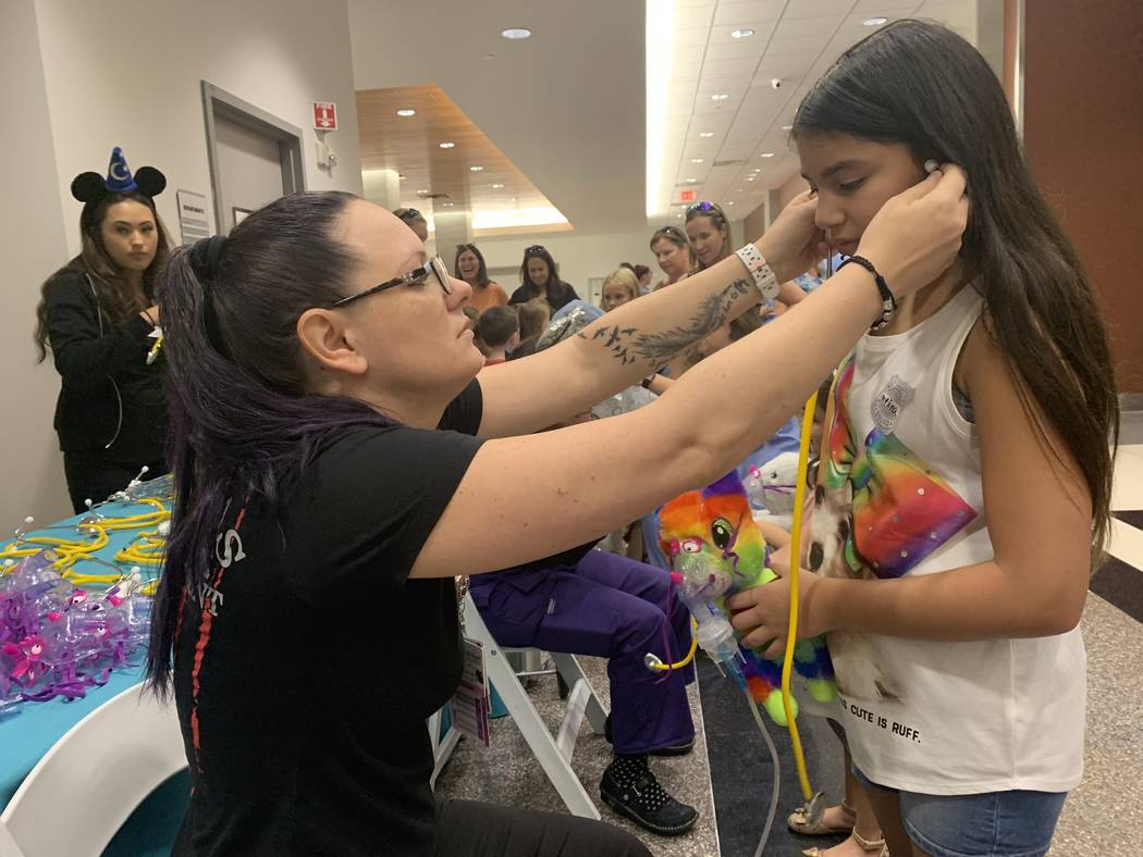 Alivia Clay, left, a respiratory therapist at Centennial Hills hospital helped perform breathin ...