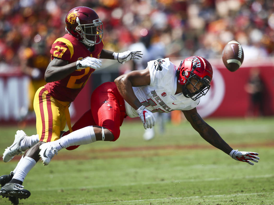 USC Trojans cornerback Ajene Harris (27) breaks up a pass intended for UNLV Rebels wide receive ...