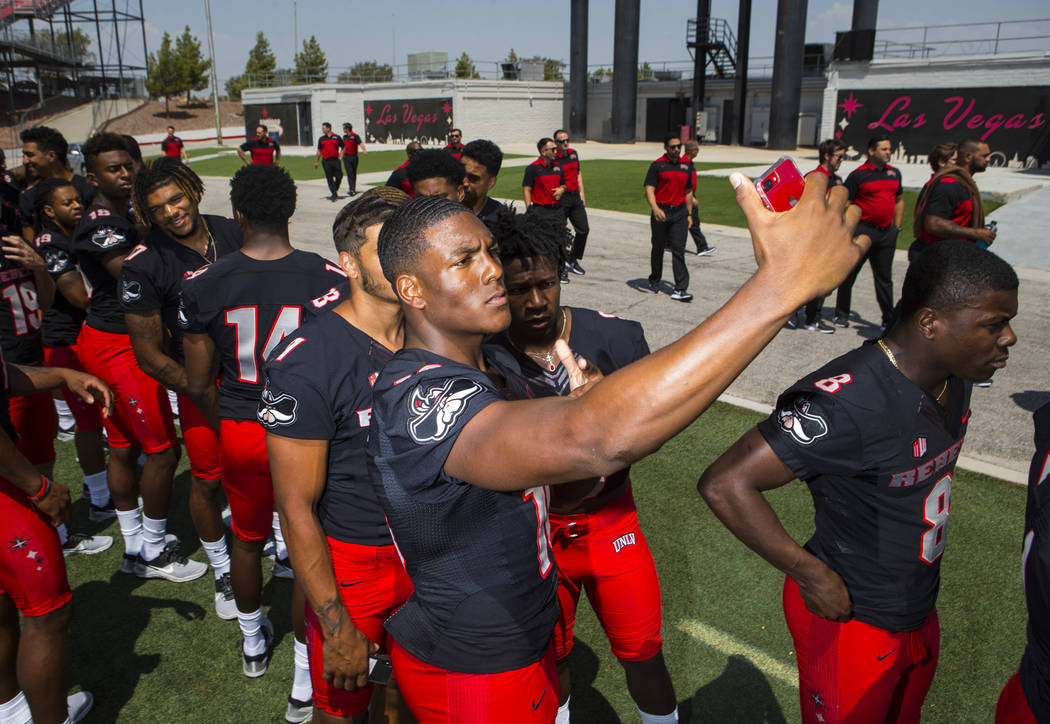 UNLV Rebels wide receiver Darren Woods Jr. (10) takes a selfie with wide receivers Drew Tejchma ...