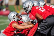 UNLV defensive back Demitrious Gibbs (22) works through a drill with defensive back Bryce Jacks ...