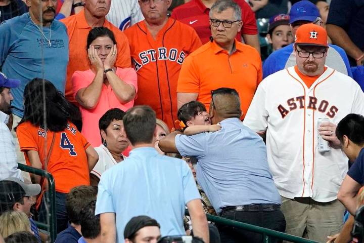 In this Wednesday, May 29, 2019, file photo, a young child is carried from the stands after bei ...