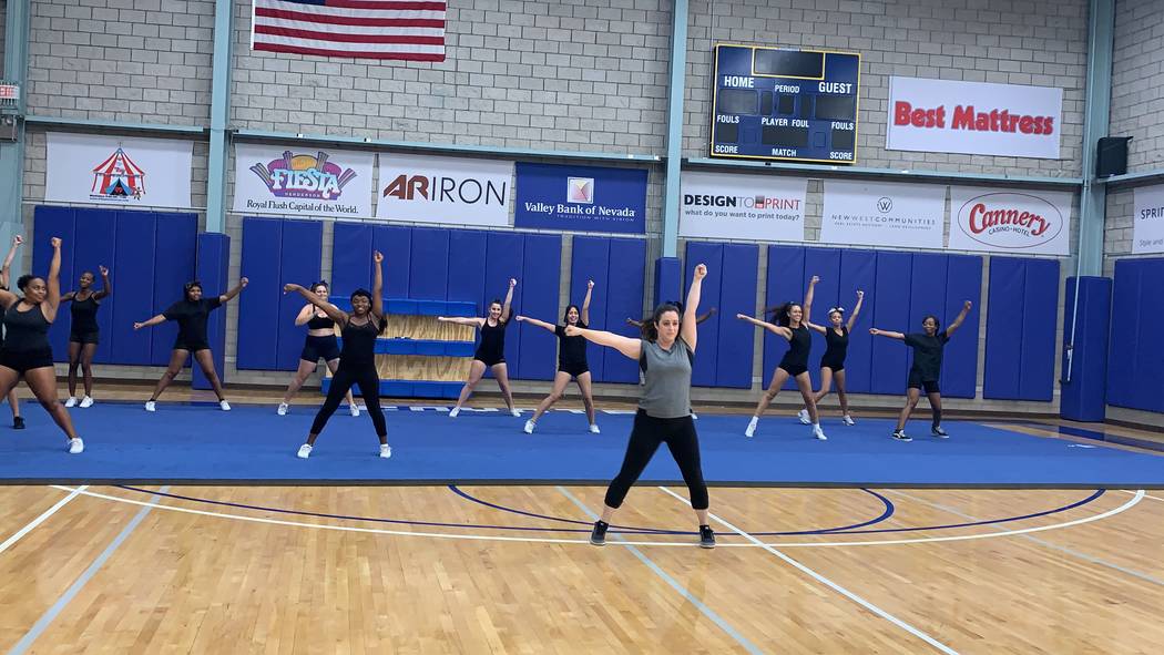 Tiffany Boulter practices a routine with her cheer squad during practice on July 31. (Mia Sims, ...