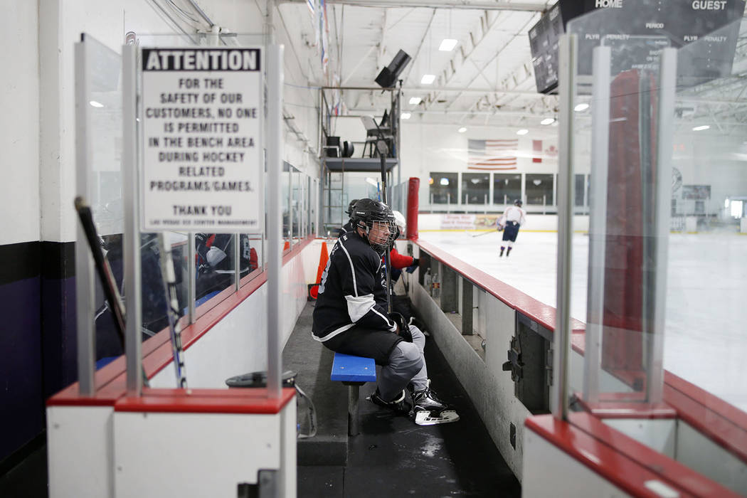 Joe Blau sits in the box during Ronnie's Hockey Club, a pickup ice hockey league at the Las Veg ...