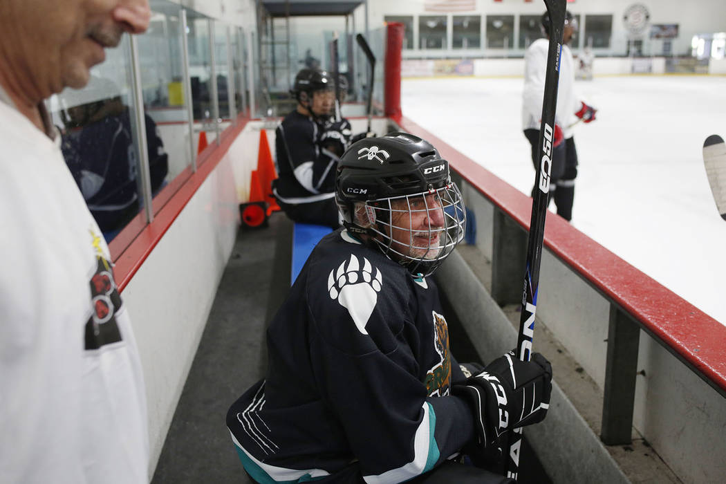Player Chuck Gariepy waits to get onto the ice during Ronnie's Hockey Club, a pickup ice hockey ...