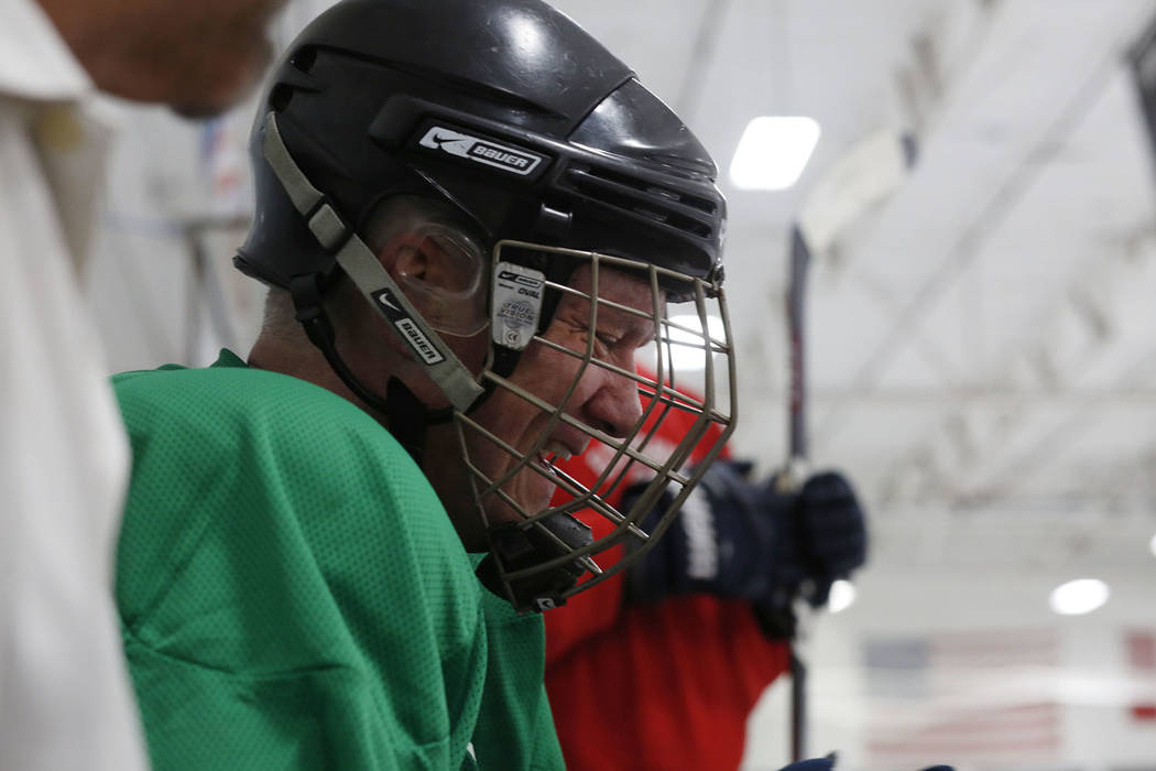 Player Sean McCrossan waits to go back onto the ice during Ronnie's Hockey Club, a pickup ice ...