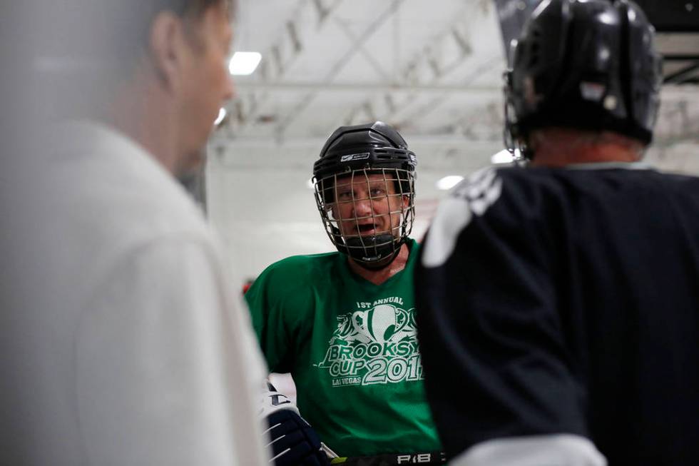 Player Sean McCrossan comes off of the ice during Ronnie's Hockey Club, a pickup ice hockey lea ...