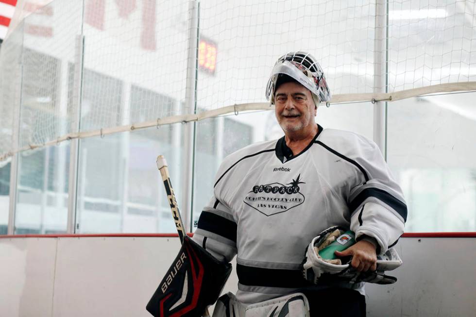 Goalie Dave Holm, 76, finishes a game during Ronnie's Hockey Club, a pickup ice hockey league a ...