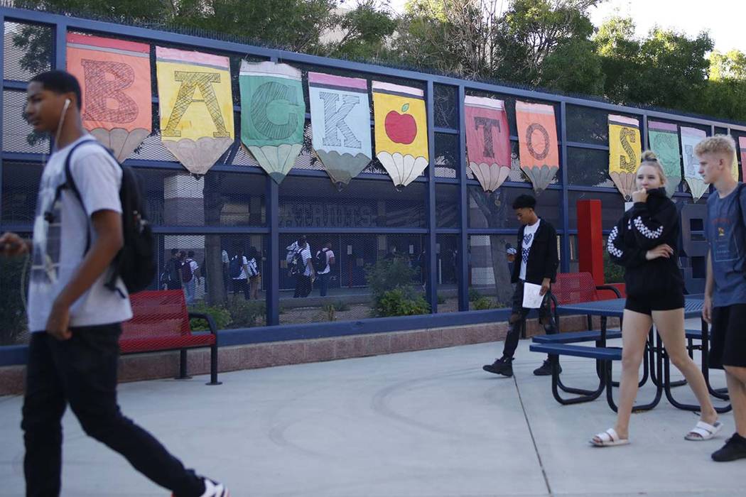 Students head to class on the first day of school at Liberty High School in Henderson, Monday, ...