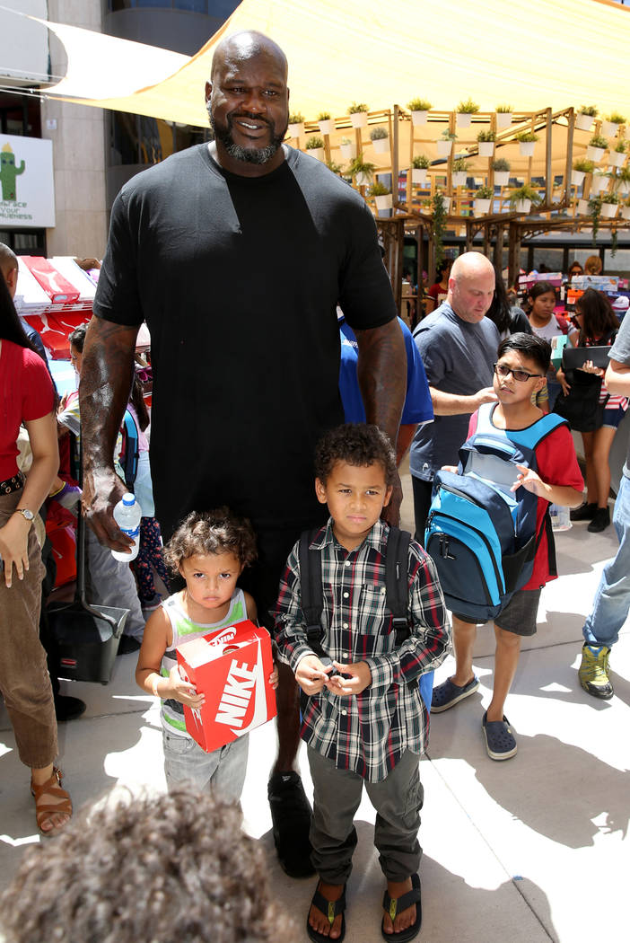 Amari Hamilton, 4, and his brother Rashawn Hamilton, 8, pose with former NBA star Shaquille O'N ...