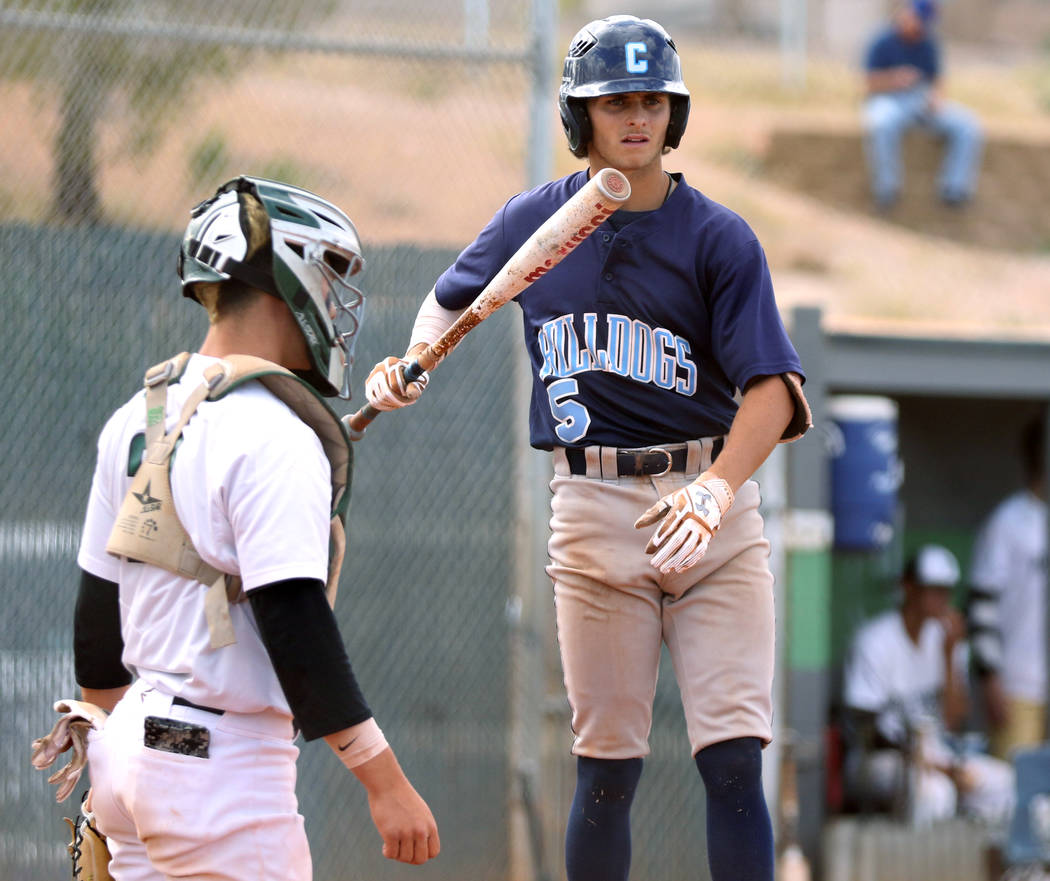 Centennial High School's Zachary Hare, right, who played on the Mountain Ridge team during the ...