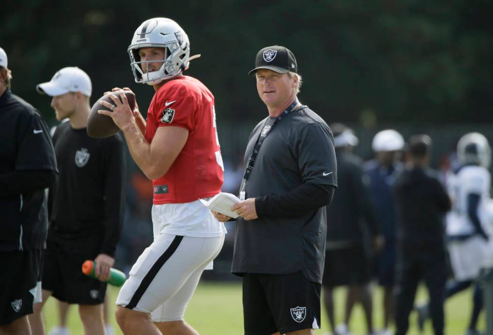 Oakland Raiders head coach Jon Gruden watches quarterback Nathan Peterman during NFL football t ...