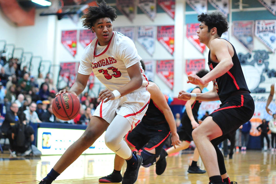 Coronado's Jhaylon Martinez (33) dribbles the ball toward the basket in the second quarter of a ...