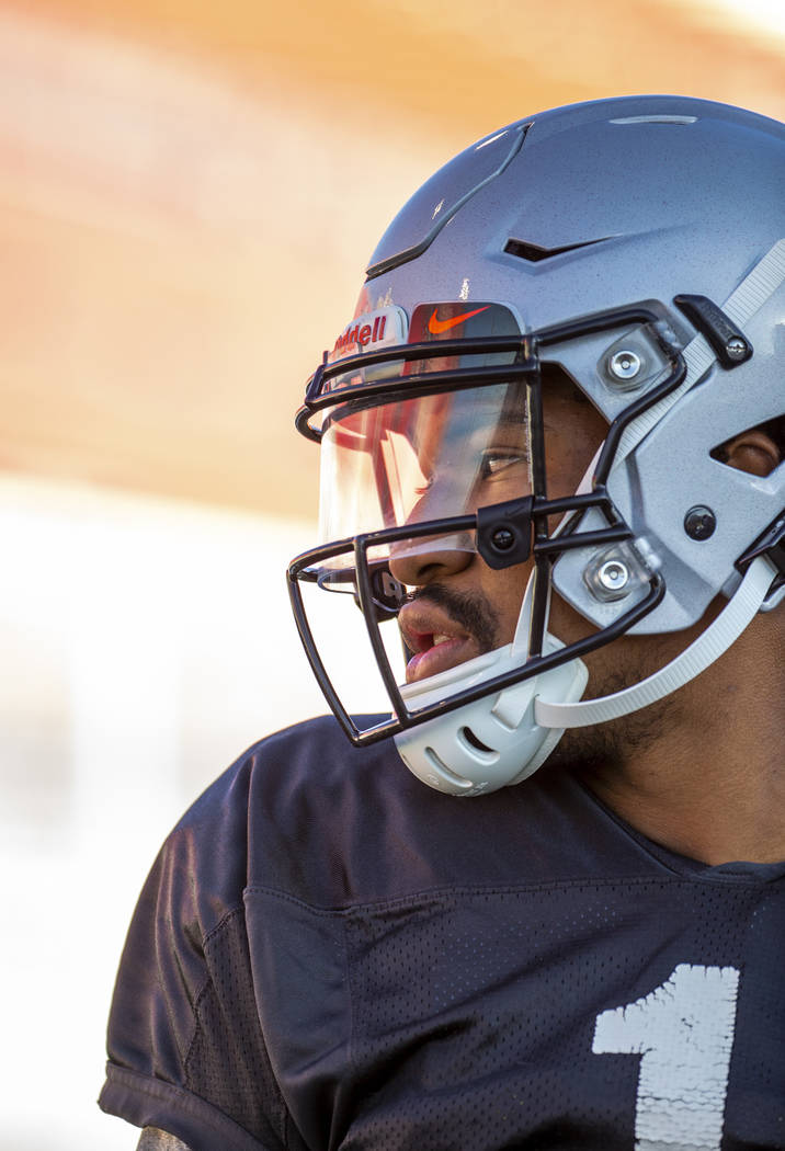 UNLV QB Armani Rogers (1) looks to his teammates during their first major scrimmage of football ...