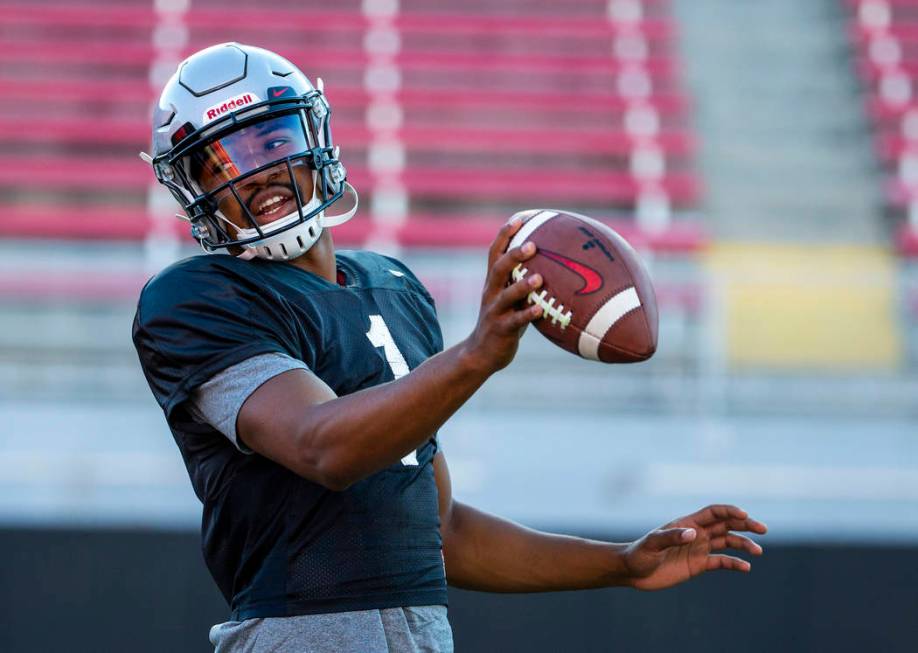 UNLV QB Armani Rogers (1) looks to make a a toss to his running back during their first major s ...