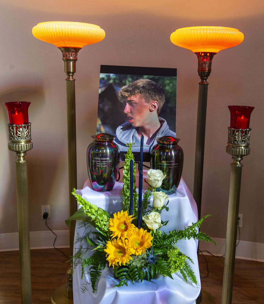 Urns and portrait of Harlee Deborski are the centerpiece during a funeral service for him in th ...