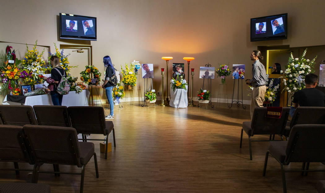 A handful of mourners remain in the chapel following the funeral service for Harlee Deborski at ...