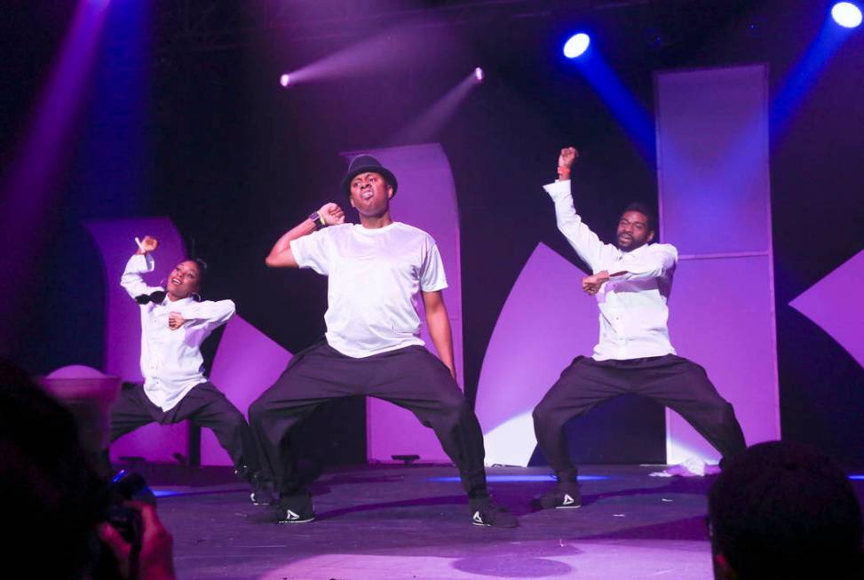 DJ Axis, center, performs with dancers during the Aid for AIDS of Nevada 33rd Annual Black &amp ...