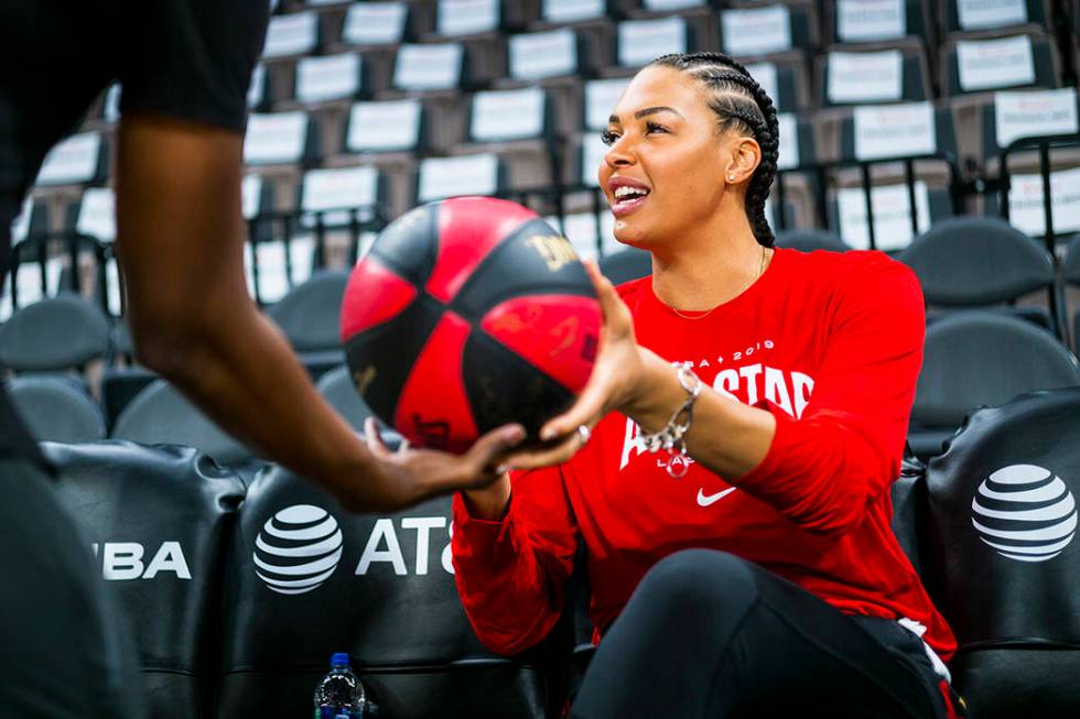 Las Vegas Aces' Liz Cambage hands a signed ball over ahead of the WNBA All-Star Game and skills ...