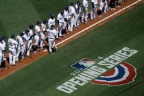 San Diego Padres manager Andy Green, center, greets his team after being introduced before an o ...