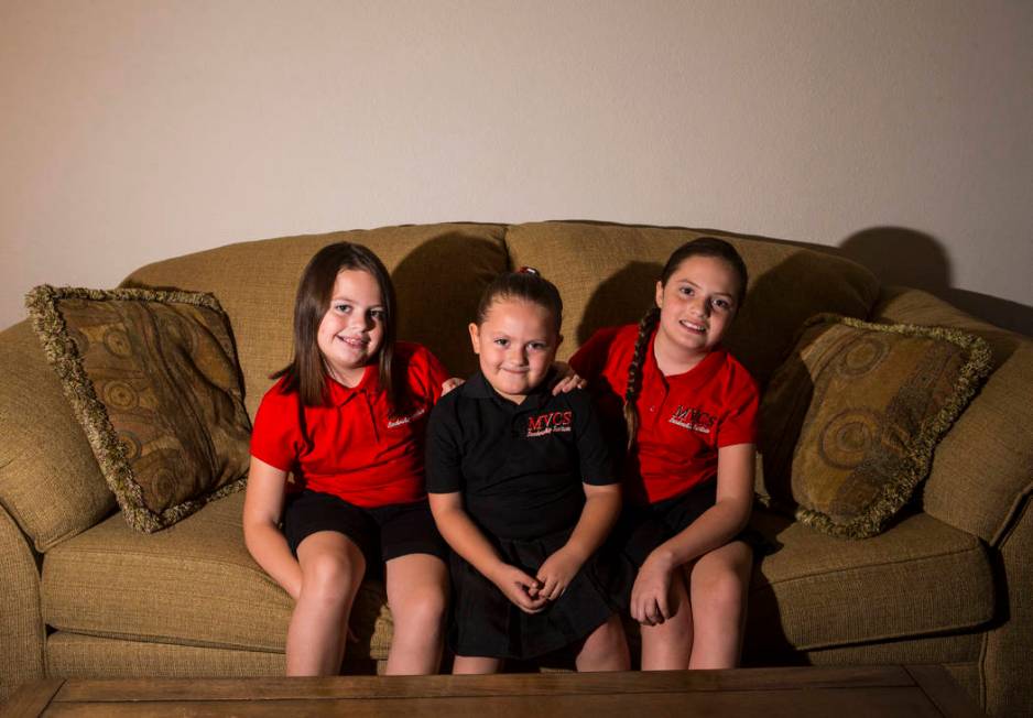 Sisters, from left, Trinity Ybarra, 8, Nala Ybarra, 5, and Elia Ybarra, 9, at their home in Las ...