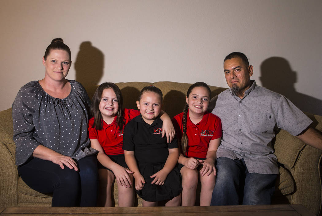 Bonnie Ybarra, left, poses with children and husband, from left, Trinity, 8, Nala, 5, and Elia, ...