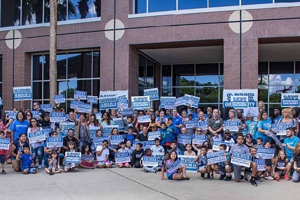 Parents and students rally to save Opportunity Scholarships at a rally outside the Grant Sawyer ...