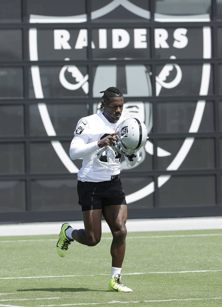 Oakland Raiders wide receiver Antonio Brown runs during an official team activity at the NFL fo ...