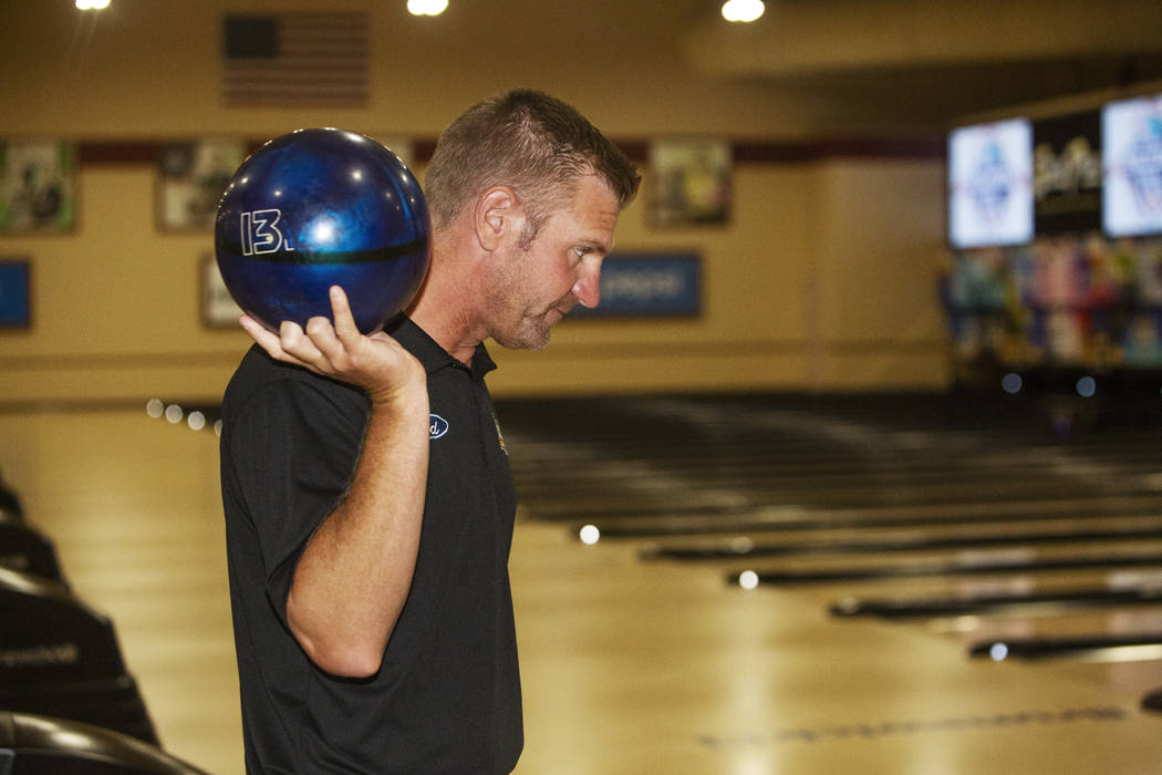 Nascar professional Clint Bowyer eyes his shot while bowling at South Point on Monday, Aug. 12, ...