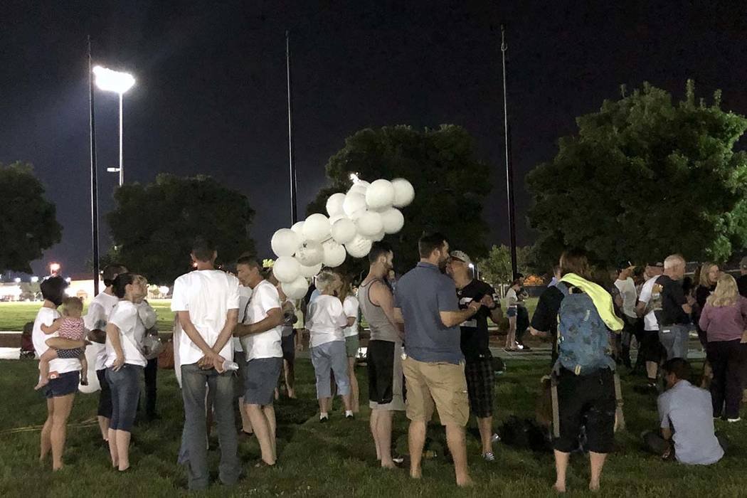 Family and friends gather for a candlelight vigil on Monday, Aug. 12, 2019, for Harlee Deborski ...