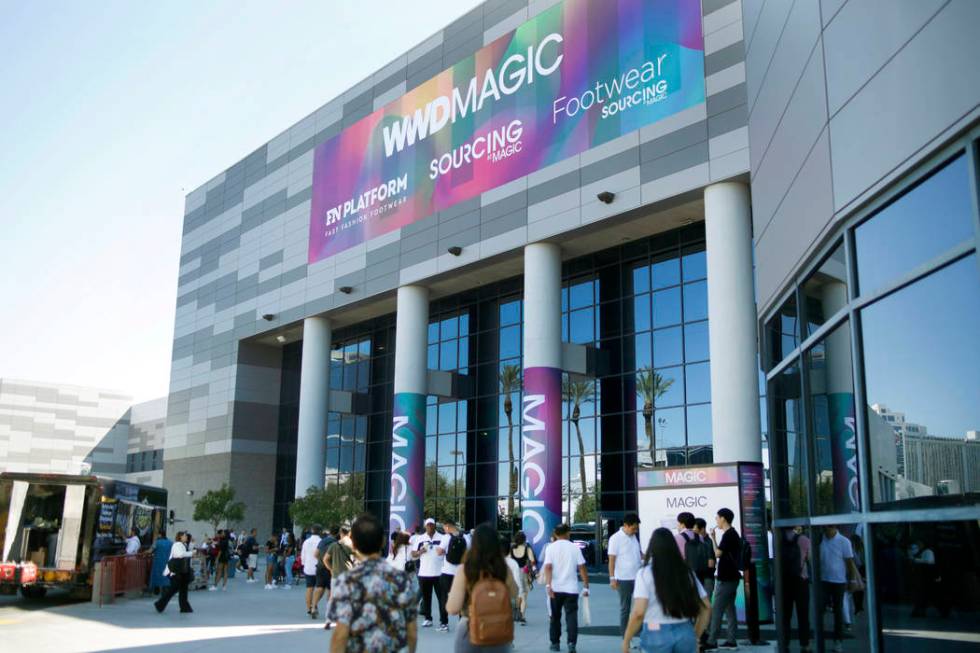 Attendees enter the show during the first day of the MAGIC trade show at the Las Vegas Conventi ...