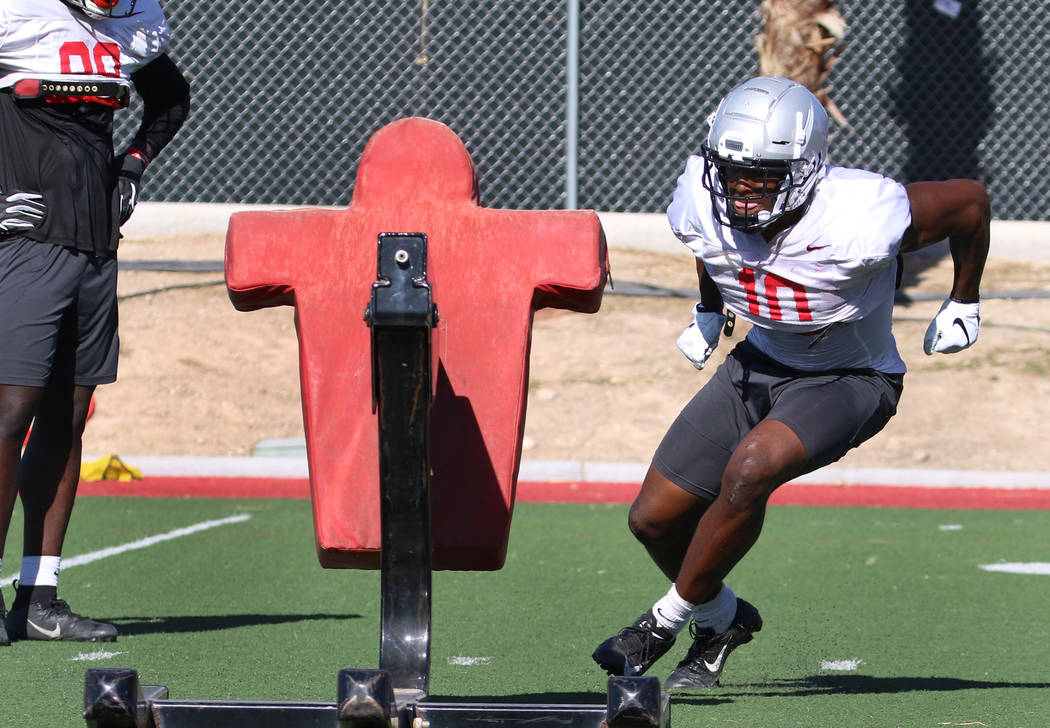 UNLV Rebels wide receiver Darren Woods Jr. (10) prepares to hits the sled during team practice ...