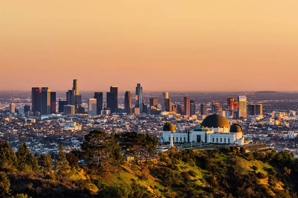 Los Angeles skyscrapers and Griffith Observatory at sunset (Getty Images)