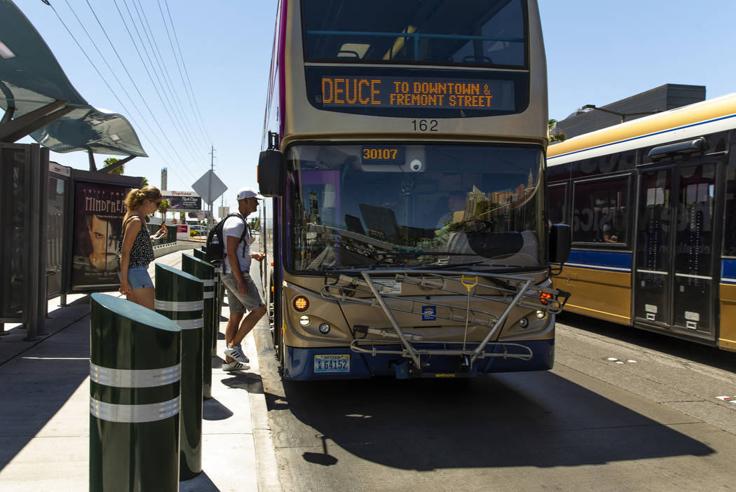 Passengers board an RTC bus near the Tropicana on the Strip on Tuesday, Aug. 13, 2019 in Las Ve ...