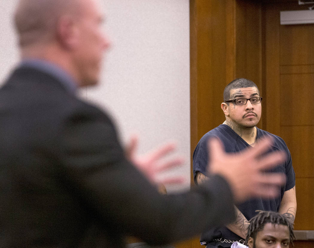 Andrew Arevalo, right, listens to defense attorney Dan Gilliam plead on his behalf during sente ...