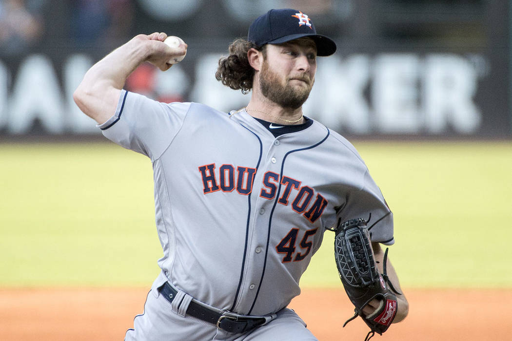 Houston Astros starting pitcher Gerrit Cole delivers against the Cleveland Indians during a bas ...