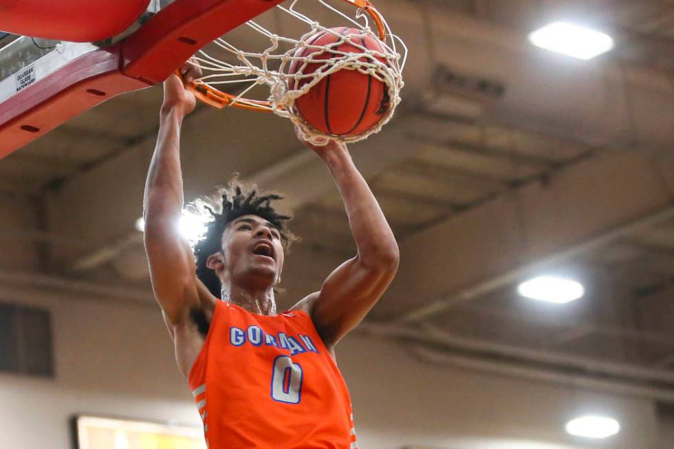 Bishop Gorman's Isaiah Cottrell (0) dunks over Findlay Prep's Alex Tchikou during the first hal ...