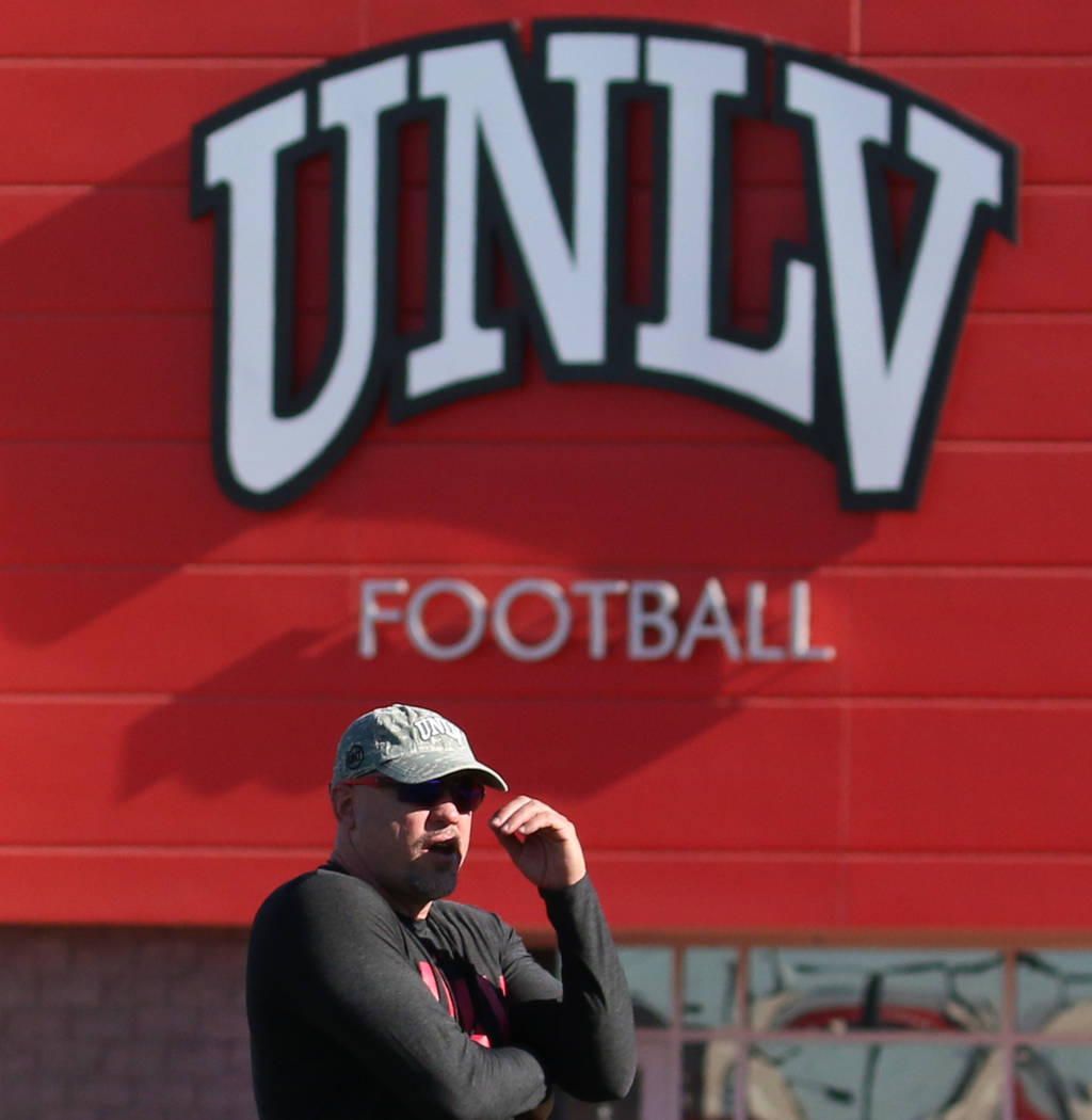 UNLV Rebels head coach Tony Sanchez watches his players during team practice on Tuesday, Aug. 1 ...