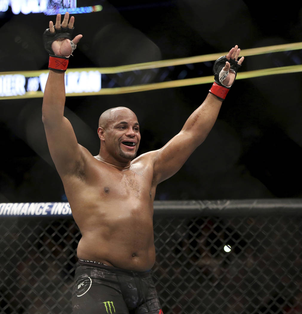 Daniel Cormier celebrates a win over Volkan Oezdemir in a light heavyweight championship mixed ...