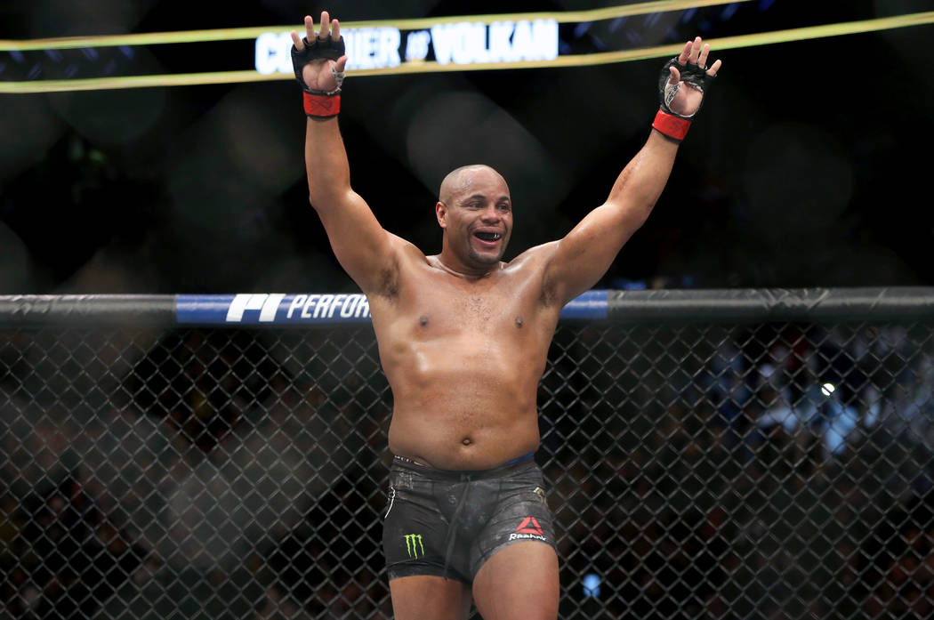 FILE - In this Jan. 20, 2018, file photo, Daniel Cormier celebrates a win over Volkan Oezdemir ...