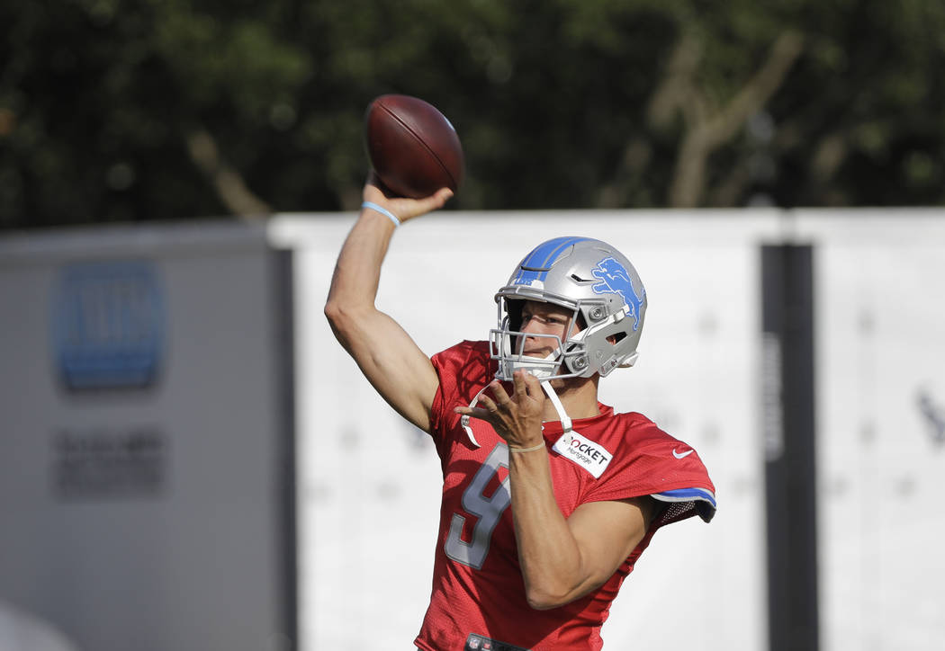 Detroit Lions quarterback Matthew Stafford (9) throws a pass during an NFL joint training camp ...