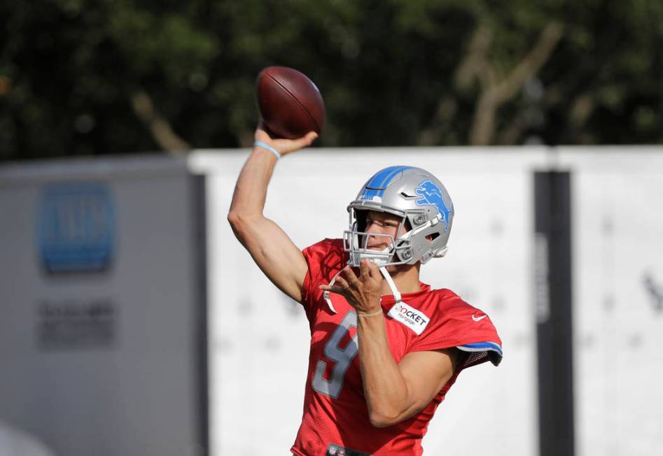 Detroit Lions quarterback Matthew Stafford (9) throws a pass during an NFL joint training camp ...