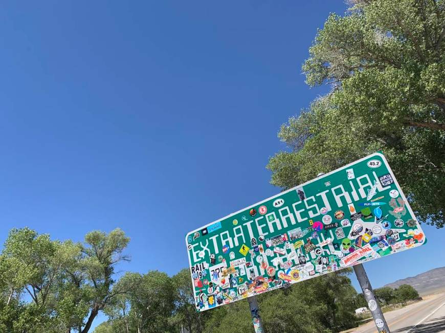 The Extraterrestrial Highway sign, covered with stickers, is seen along State Route 375 on July ...