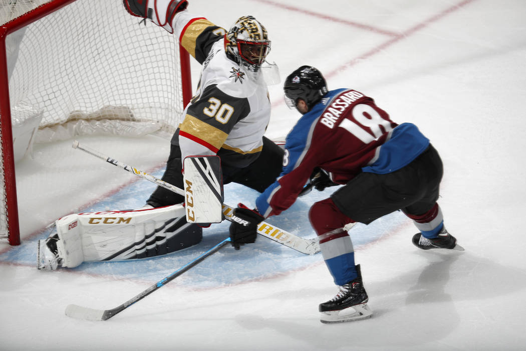 Vegas Golden Knights goaltender Malcolm Subban, left, makes a save against Colorado Avalanche c ...